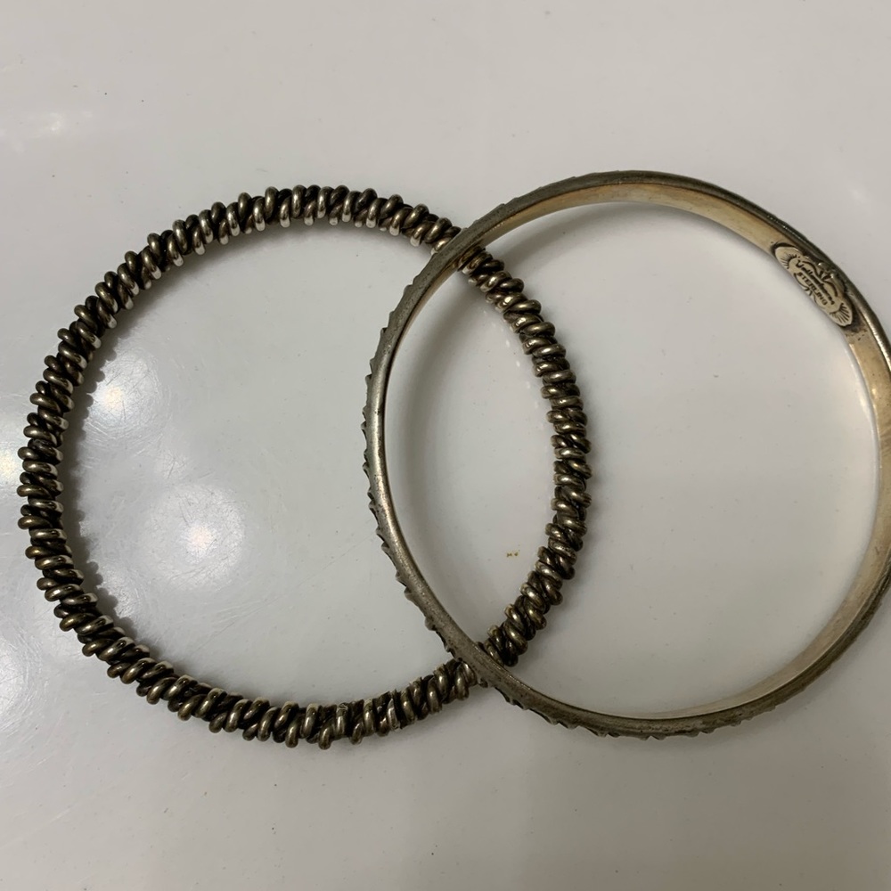 Two Handmade Pat Yellowhorse Sterling Silver Bangles